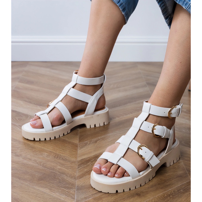White gladiator sandals fastened with ankle 1