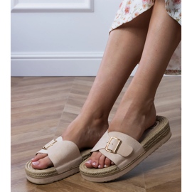 Beige flip flops on the platform with a buckle on the bar 2