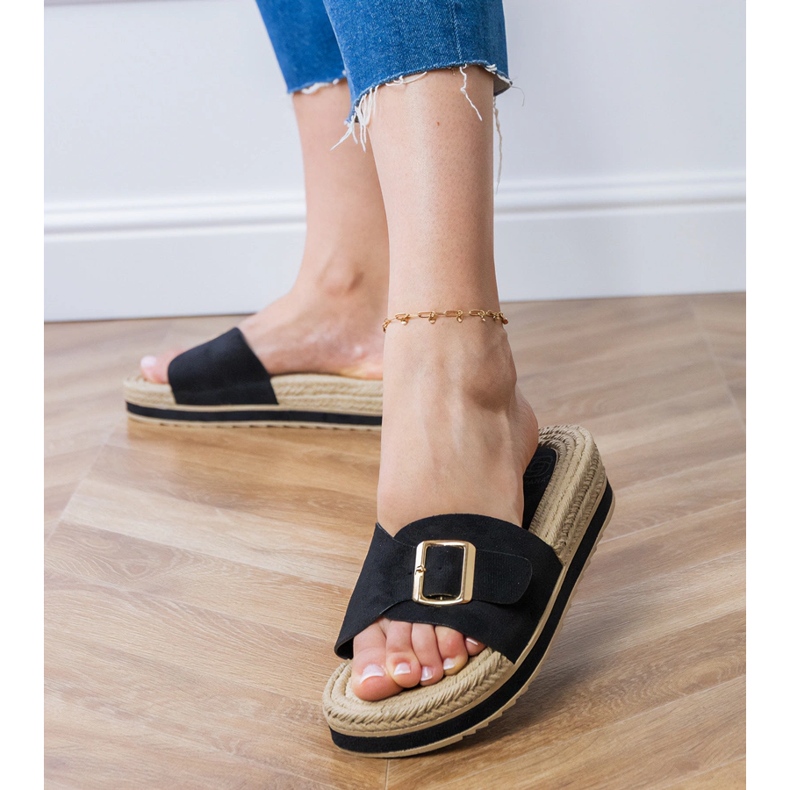 Black flip flops on the platform with a buckle on the belt 2