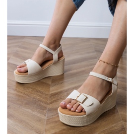 Beige women's sandals with a decorative buckle 1