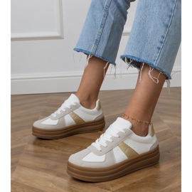 Women's white sneakers on the platform 1