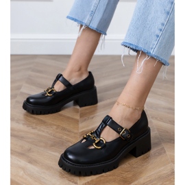 Black shoes on a thick sole with a golden decoration 1 Black shoes on a thick sole with a golden decoration 1