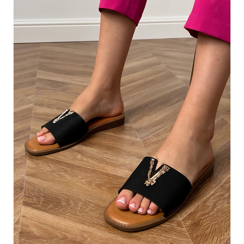 Black flip flops with a golden decoration 1