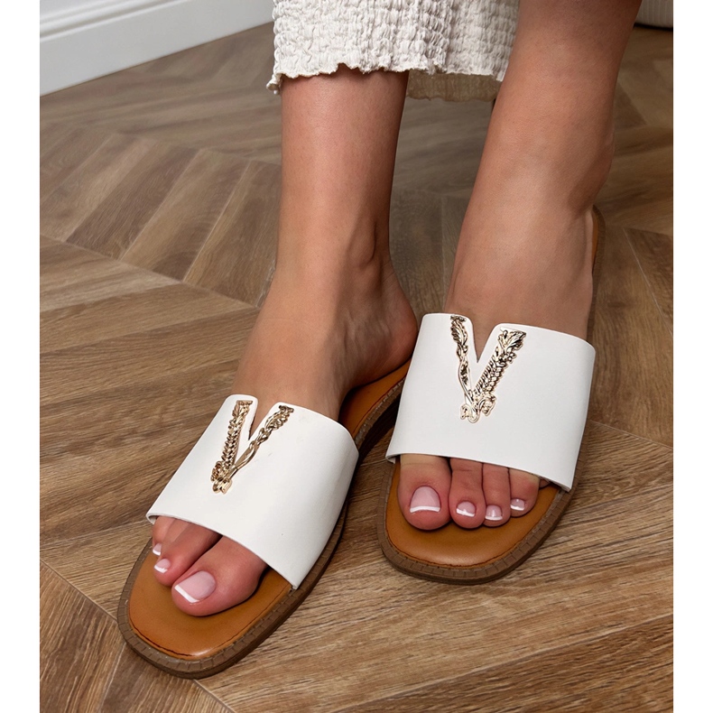 White flip flops with a golden decoration 1