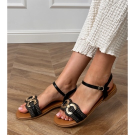 Black flat sandals with a golden decoration 1 Black flat sandals with a golden decoration 1