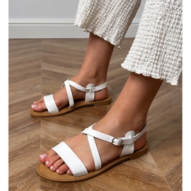 White flat sandals with a belt 1