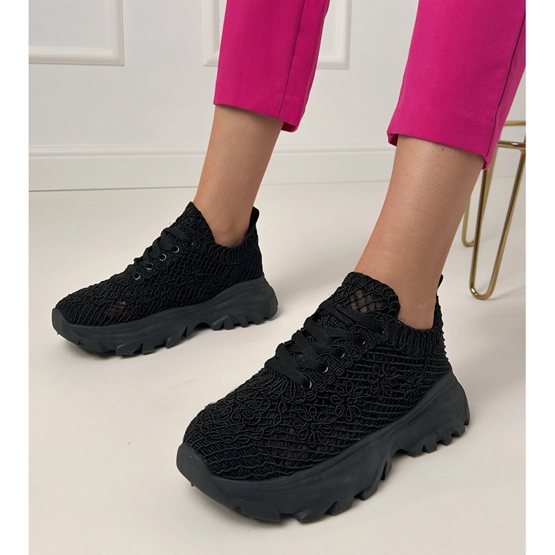Black openwork sneakers on the platform 1