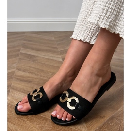 Black flip flops with a golden decoration on the bar 1