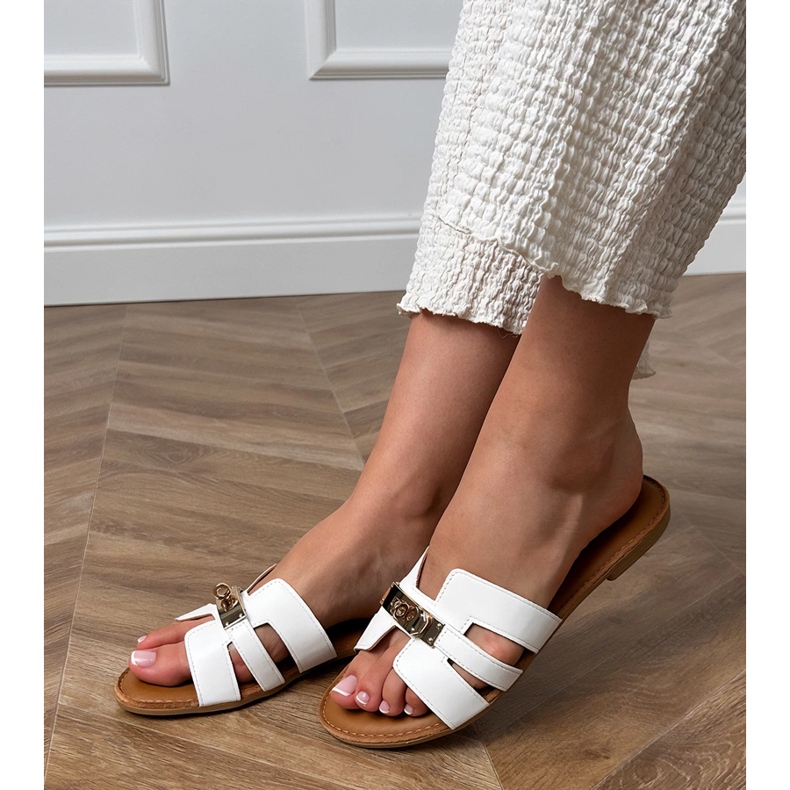 White flip flops with cutouts on the belt and golden decoration 1 White flip flops with cutouts on the belt and golden decoration 1