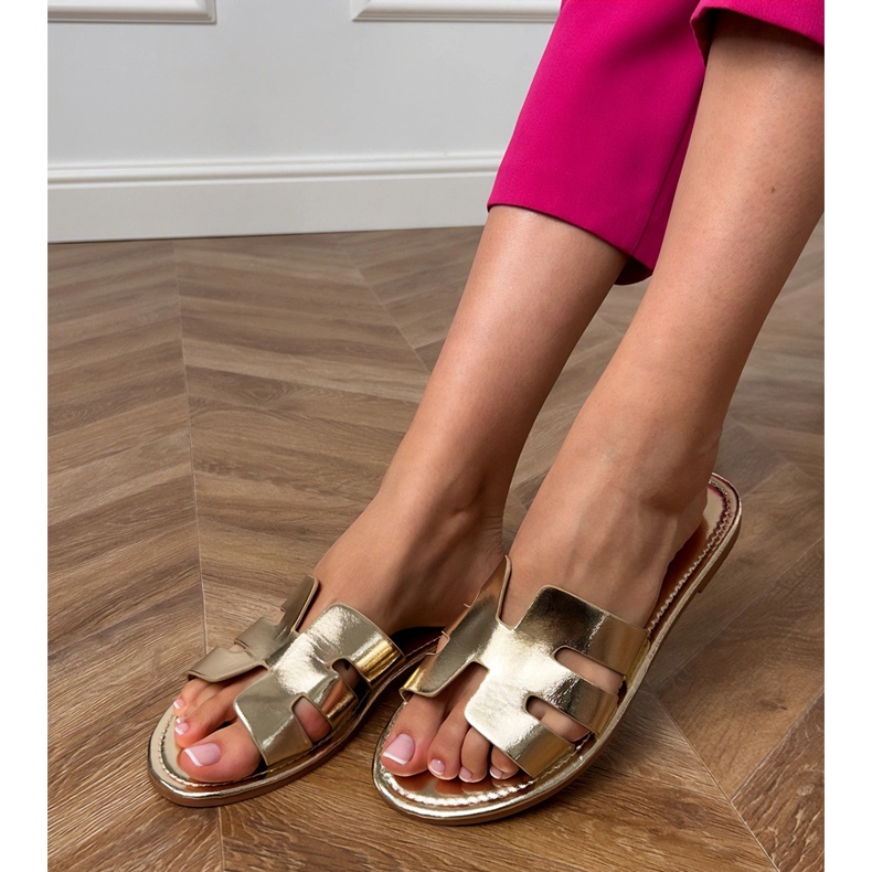 Golden flip -flops decorated with cutouts 2