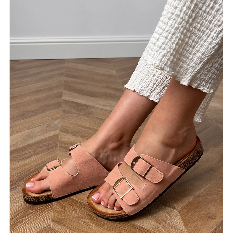 Pink flip flops with clamps on a cork sole 1