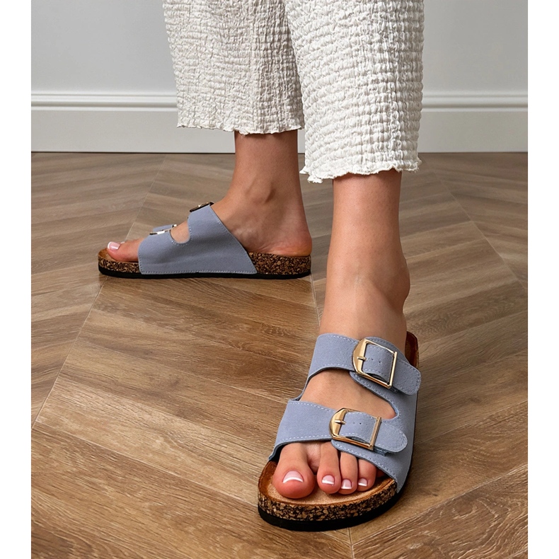 Blue flip flops with clamps on a cork sole 1