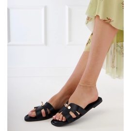 Black flip flops with cutouts on the belt and golden decoration 1 Black flip flops with cutouts on the belt and golden decoration 1
