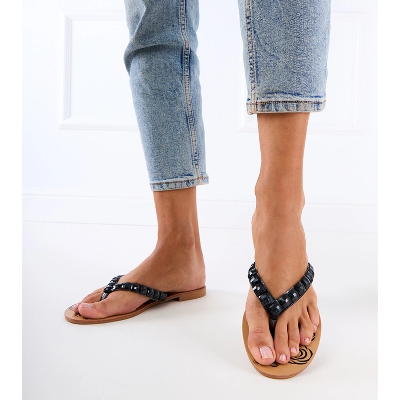 Black flip -flops flip -flops decorated with pebbles 1