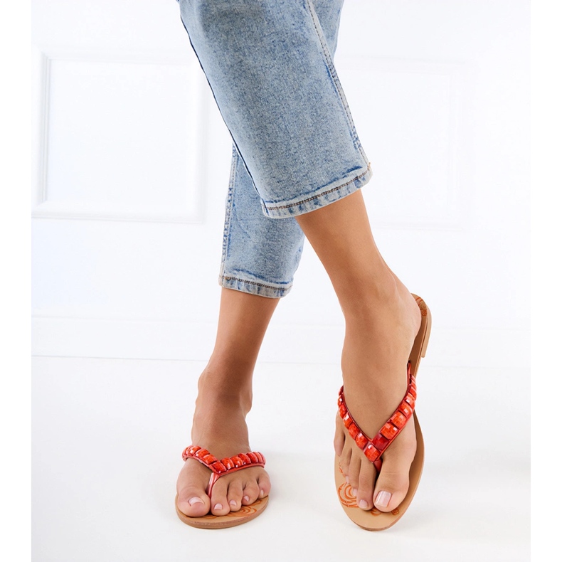 Orange flip -flops flip -flops decorated with pebbles 1