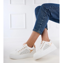 White sneakers with gold inserts on the platform 2