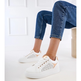 White sneakers with gold inserts on the platform 1
