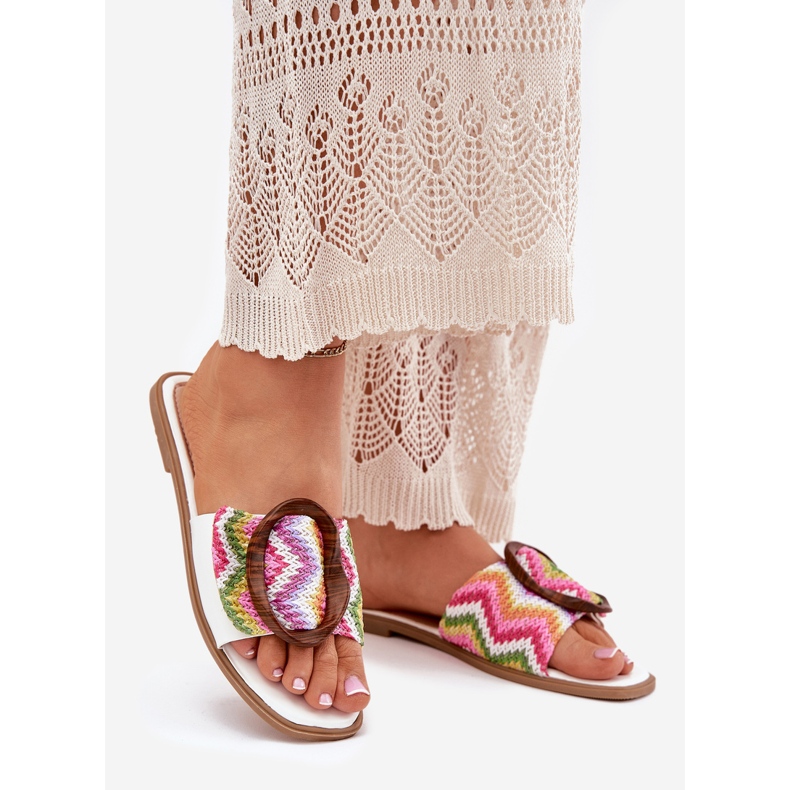 Flat women's flip flops with a decorative white buckle 1