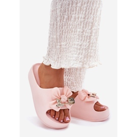 Women's foam slippers on the platform with a bow and a pink brooch 1