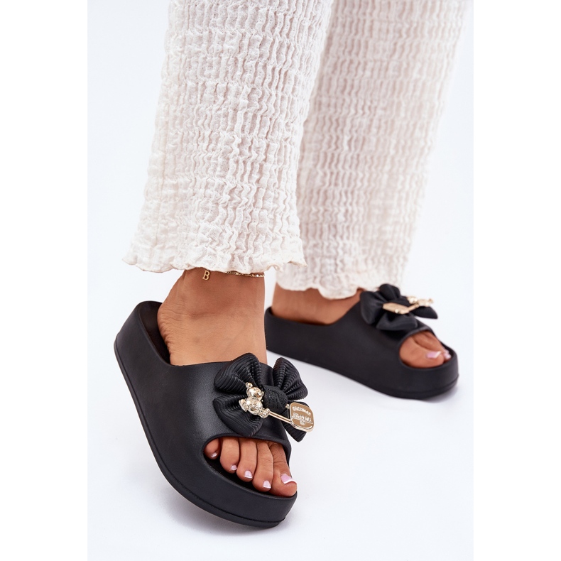 Women's foam slippers on the platform with a bow and a black brooch 2