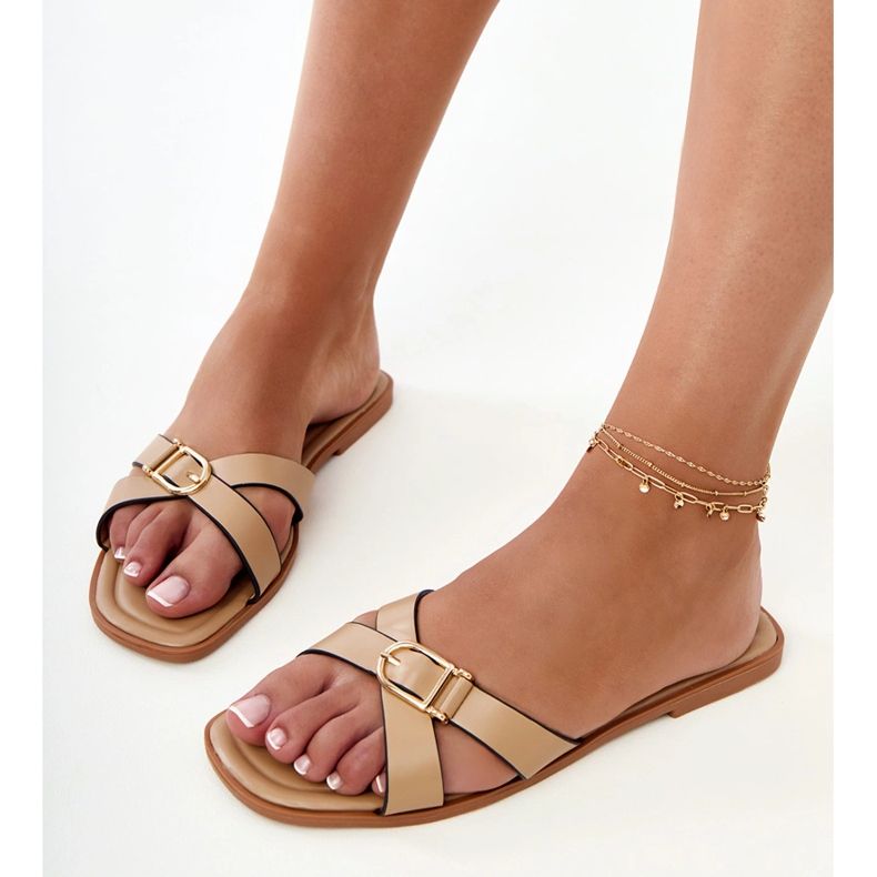 Brown flip -flops with a decorative buckle on the belt 1