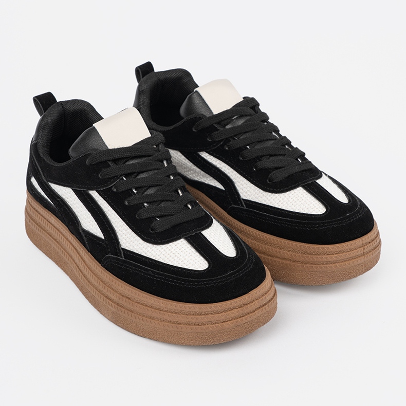 Black women's sneakers with white inserts. 2