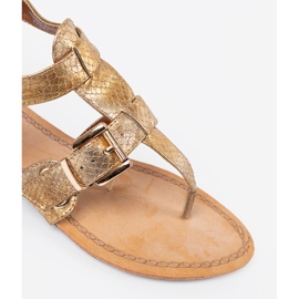 Golden sandals in the style of Japanese with buckles 1