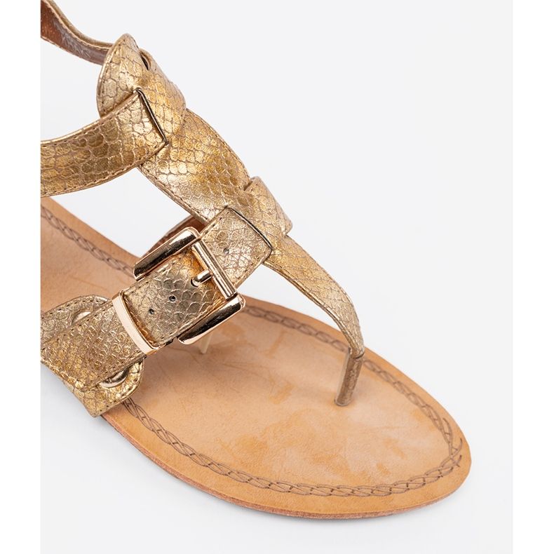 Golden sandals in the style of Japanese with buckles 1