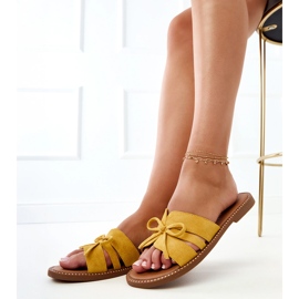 Yellow flip flops with a bow and decoration at the edges 2