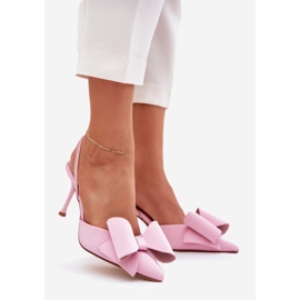 High heels with bare heels and a pink bow 1