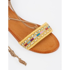 Brown sandals with a decorated strap 1