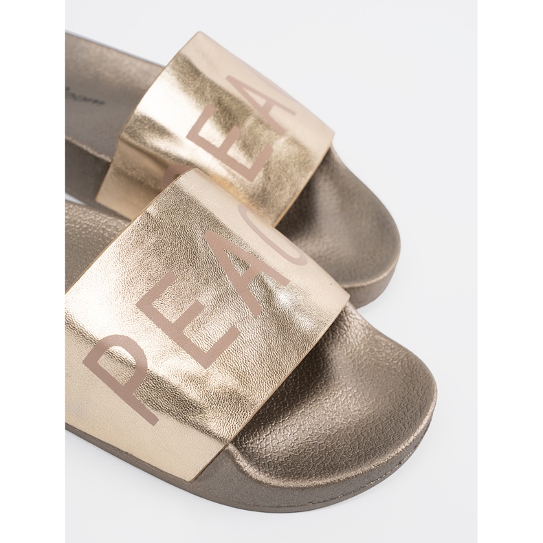 Shelvt Golden flat flip flops with an inscription 1