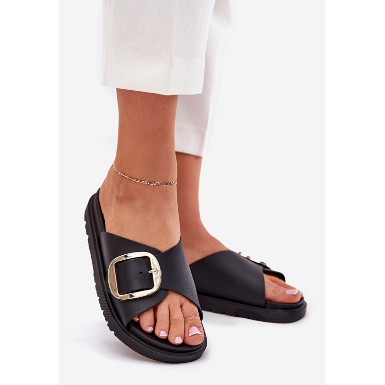 Women's flip flops on the platform with a golden clamp black 1