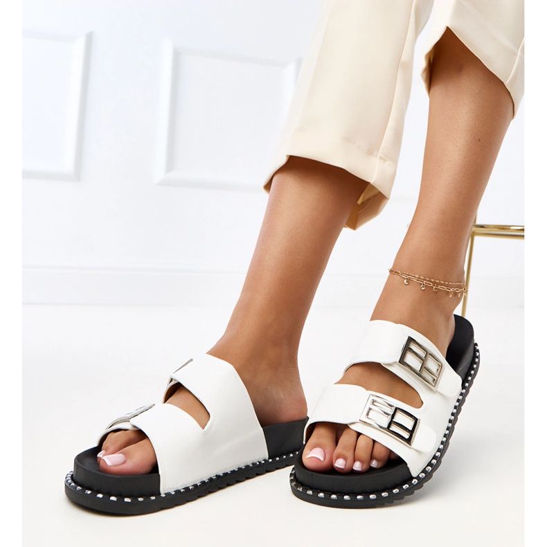 White flip flops on the Blau platform 1