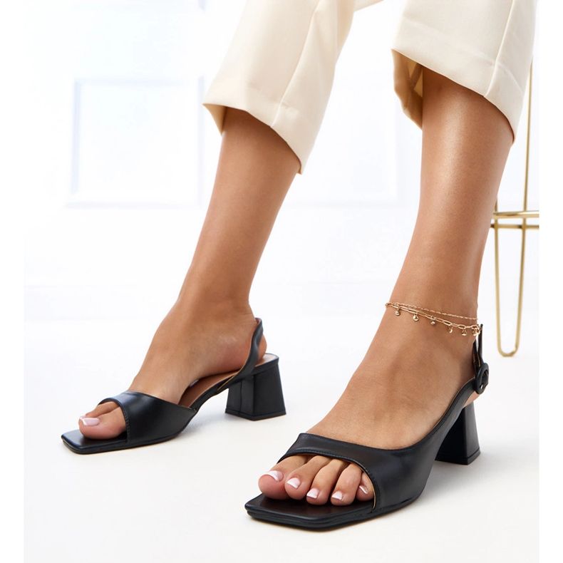 Black sandals with a square toe on the Lourdes post 1