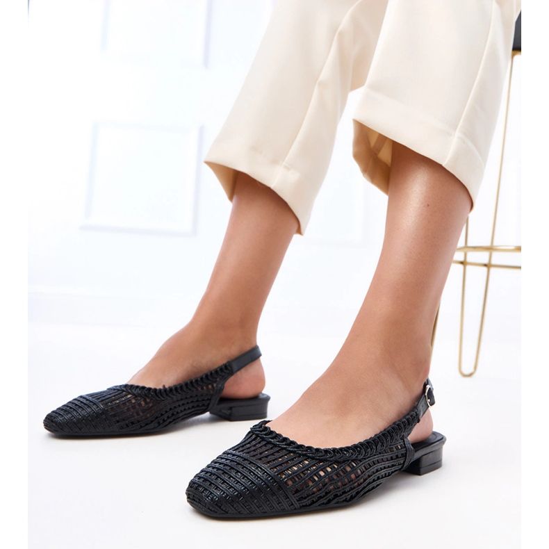 Black openwork ballerinas with an exposed Eve heel 1