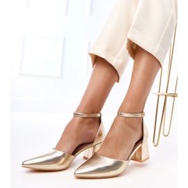 Golden pumps on the post fastened on Keris cubes 2