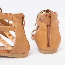 Shelvt Sanadals lace -up with a snake motif 1