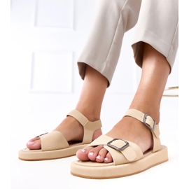 Beige sandals with a buckle on the Mirkas bar 1
