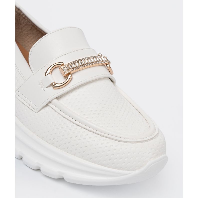 Shelvt White loafers with a decorative golden element. 1