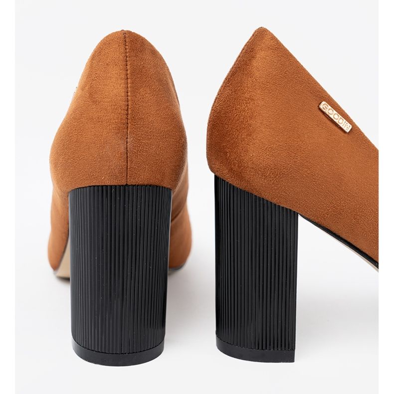 Goodin Light brown pumps on a black post 1