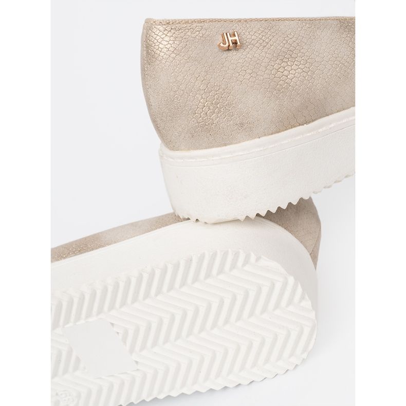 Shelvt Golden moccasins with a jewelry detail on the front 1