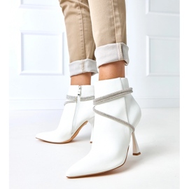 White boots on a high heel decorated with fantaro zircons 1