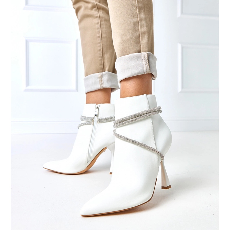 White boots on a high heel decorated with fantaro zircons 1