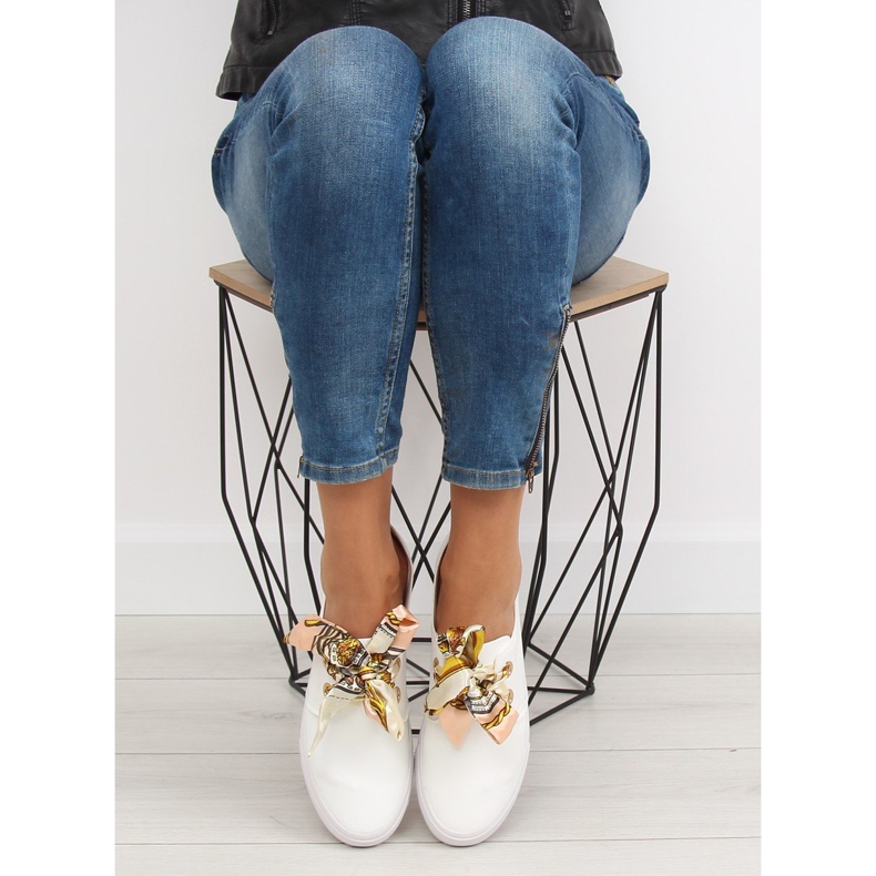 Sneakers laced with a white ribbon 1