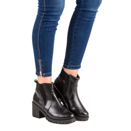 Black Chelsea Boots On A Bar 1