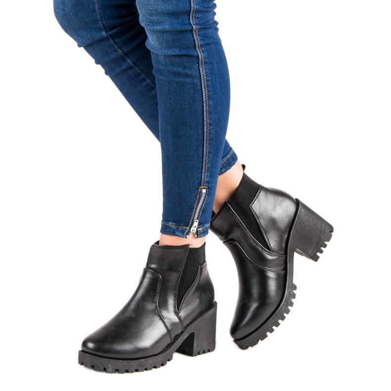 Black Chelsea Boots On A Bar 2