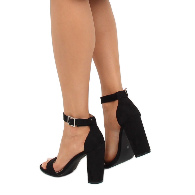 Black sandals on the post. 369-18 Black 1