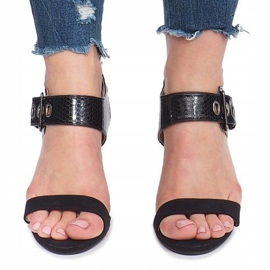Black sandals on a Colier post 1