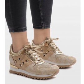 Golden sneakers on the wedge G-127 1